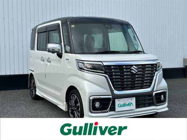 スズキ スペーシア カスタム HYBRID XS ターボ 千葉県 2018(平30)年 0.6万km ピュアホワイトパール/ブラック2トーン 純正8インチメモリナビ/(フルセグTV BT CD DVD FM AM)/全周囲カメラ/衝突被害軽減システム/車線逸脱警報/クルーズコントロール/両側パワースライドドア/横滑り防止装置/ETC/ドライブレコーダー/アイドリングストップ/LEDヘッドライト/フォグランプ/オートライト/ウィンカーミラー/電動格納ミラー/純正15インチAW/シートヒーター/シートリフター/プッシュスタート/スマートキー/スペアキー/フロアマット/ドアバイザー/取扱説明書/保証書