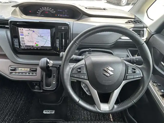 スズキ ソリオ バンディット HV MV 大阪府 2021(令3)年 1.5万km スーパーブラックパール 純正８インチナビ/   フルセグTV/CD/DVD/Bluetooth/USB/全方位モニター/衝突軽減ブレーキ/横滑り防止装置/コーナーセンサー/へッドアップディスプレイ/片側パワースライドドア/レーダークルーズコントロール/レーンキープアシスト/アイドリングストップ/前後ドライブレコーダー/純正15インチアルミホイール/純正フロアマット/プッシュスタート/スマートキー/ＥＴＣ/ＬＥＤ/禁煙車