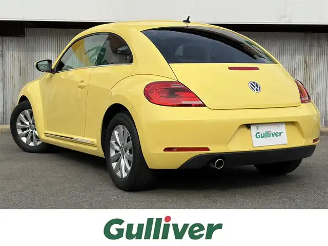 フォルクスワーゲン ザ・ビートル デザイン 三重県 2013(平25)年 5.6万km サンフラワー 登録時走行距離５５３７７km/カロツェリアナビ　/　・フルセグTV/　・DVD/CD再生/　・SD/バックカメラ/キーレス/スモークフィルム/HIDヘッドライト/フォグライト/リアフォグライト /革巻きステアリング/電動格納ミラー/フロアマット/横滑り防止機能