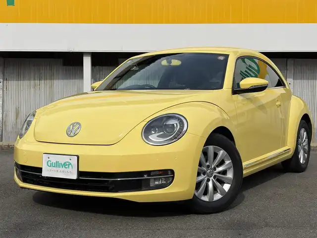 フォルクスワーゲン ザ・ビートル デザイン 三重県 2013(平25)年 5.6万km サンフラワー 登録時走行距離５５３７７km/カロツェリアナビ　/　・フルセグTV/　・DVD/CD再生/　・SD/バックカメラ/キーレス/スモークフィルム/HIDヘッドライト/フォグライト/リアフォグライト /革巻きステアリング/電動格納ミラー/フロアマット/横滑り防止機能