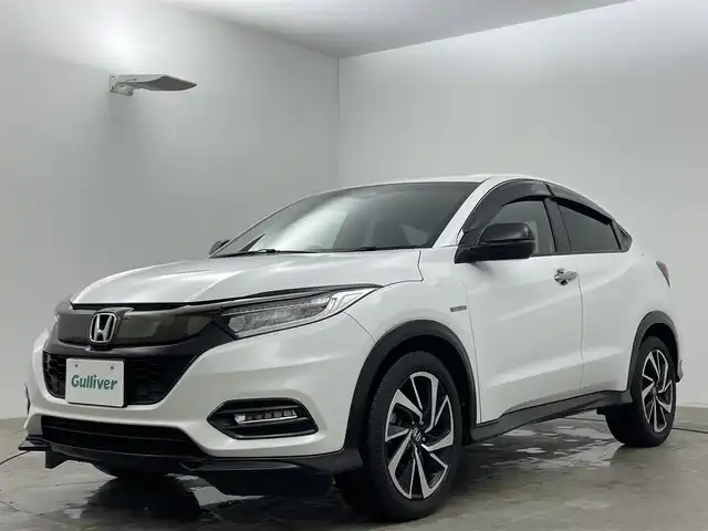 ホンダ ヴェゼル ハイブリッド RS ホンダセンシング 岡山県 2019(平31)年 6.8万km プラチナホワイトパール 純正８インチメモリナビ/【Bluetooth/フルセグTV/Carplay/HDMI】/衝突軽減ブレーキシステム/追従型クルーズコントロール/ビルトインＥＴＣ/ＬＥＤヘッドライト/バックカメラ/前席シートヒーター/純正ドライブレコーダー（前）/オートブレーキホールド/パドルシフト/ISOFIX/ステアリングスイッチ/チルトステアリング/シートリフター/ウインカーミラー/ドアバイザー/新車保証書/取扱説明書/スマートキー×2