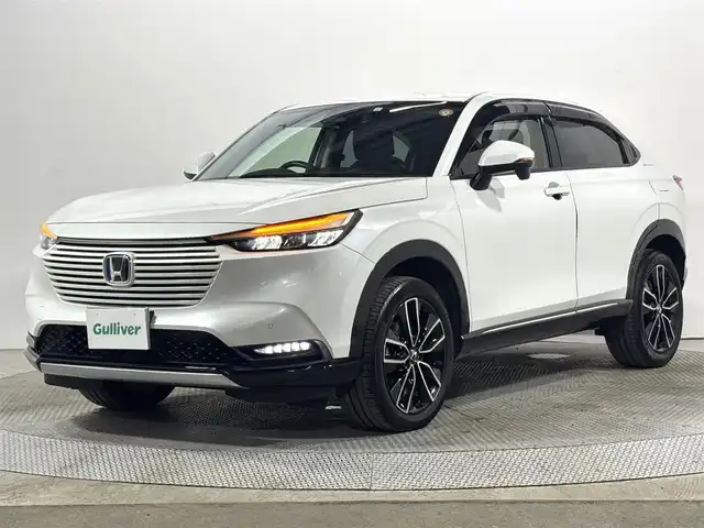 ホンダ ヴェゼル ハイブリッド e:HEV Z 大阪府 2021(令3)年 2.7万km プラチナホワイトパール ホンダセンシング 純正9incナビTV Bカメラ ETC ハーフレザー シート＆ハンドルヒーター 電動リアゲート 衝突軽減 レーダーC クリアランスソナー BSM ダウンヒルアシスト 前後ドラレコ