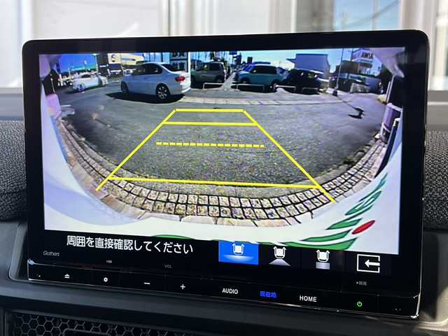 ホンダ ステップワゴン eHEV エアー EX 静岡県 2025(令7)年 0.1千km プラチナホワイトパール 純正ナビ/・CD/DVD/・AM/FM/・フルセグTV/・Music Rack/・SD/・USB/・Bluetooth/ホンダセンシング/●衝突軽減ブレーキ（CMBS）/●先行車発進お知らせ機能/●歩行者事故低減ステアリング/●路外逸脱抑制機能/●標識認識機能/●渋滞追従機能付アダプティブクルーズコントロール（ACC）/●車線維持支援システム（LKAS）/●トラフィックジャムアシスト（渋滞運転支援機能）/●ブラインドスポットインフォメーション/●誤発進抑制機能/●後方誤発進抑制機能/●近距離衝突軽減ブレーキ/●急アクセル抑制機能/●パーキングセンサーシステム/●オートハイビーム/●アダプティブドライビングビーム/主要装備/・後席フリップダウンモニター/・2列目オットマン/・全列USBチャージャー/・リアオートエアコン/・パワーテールゲート/・サイドカーテンエアバッグ/・運転席+助手席シートヒーター