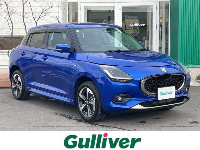 スズキ スイフト HYBRID MZ 青森県 2024(令6)年 0.3万km 青 4WD/純正9インチメモリナビ・フルセグTV/CD・DVD・Bluetooth/全方位モニター/前席シートヒーター/セーフティサポート/デュアルセンサーブレーキサポート2/アダプティブクルーズコントロール/レーンキープアシスト/ブラインドスポットモニター/アダプティブハイビーム/パドルシフト/ドアミラーヒーター/ビルトインETC/純正フロアマット/LEDヘッドライト/オートライト/LEDフォグランプ/純正16インチアルミ/スペアキー