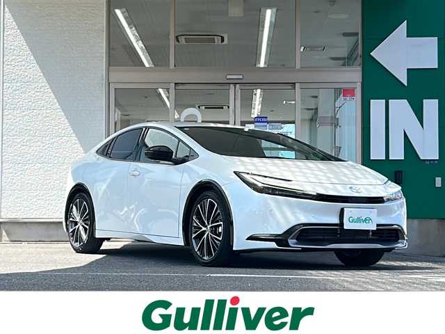 トヨタ プリウス Z 愛知県 2024(令6)年 0.7万km プラチナホワイトパールマイカ 禁煙車/ワンオーナー/革シート/純正メーカーナビ/Miracast/フルセグ/パノラミックビューモニター/デジタルインナーミラー/　（ドライブレコーダー内蔵）/純正ビルトインETC/電動リアゲート/トヨタセーフティセンス/アドバンストパーク/ステアリングリモコン/前後コーナーセンサー/クリアランスソナー/アダプティプクルーズコントロール/ブラインドスポットモニター/置くだけ充電/ハンドルヒーター/シートヒーター（D/N席）/エアーシート（D/N席）/パワーシート（D席）/メモリーシート（D席）/D/Nサンシェード/純正19アルミ/純正フロアマット/フォグランプ/純正LEDヘッドライト/AUTOライト/AUTOハイビーム/100V充電/電動格納ミラー/スペアキー/取説/保証書