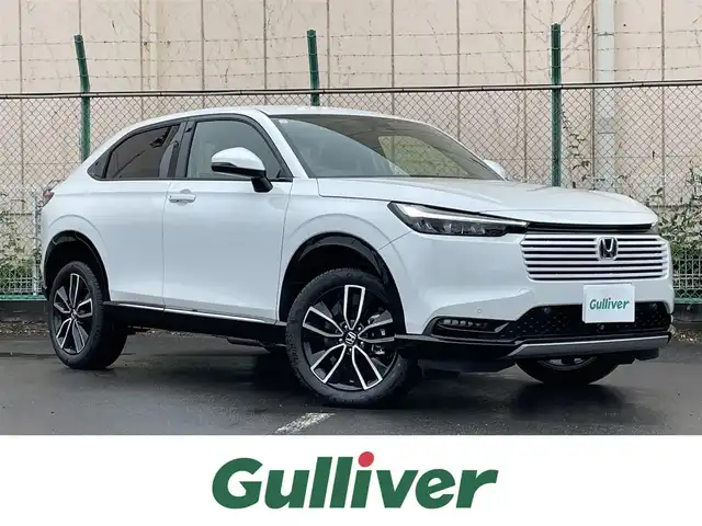 ホンダ ヴェゼル ハイブリッド e:HEV Z 東京都 2025(令7)年 0.1千km プラチナホワイトパール 登録済未使用車　/純正ナビ　/置型充電　/BSM　/ETC2.0　/レーダークルーズコントロール　/18インチ純正ホイール　/純正LED　/電動リアケート　/シートヒーター　/衝突被害軽減ブレーキ　/盗難防止装置