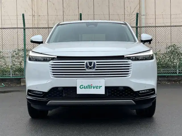 ホンダ ヴェゼル ハイブリッド e:HEV Z 東京都 2025(令7)年 0.1千km プラチナホワイトパール 登録済未使用車　/純正ナビ　/置型充電　/BSM　/ETC2.0　/レーダークルーズコントロール　/18インチ純正ホイール　/純正LED　/電動リアケート　/シートヒーター　/衝突被害軽減ブレーキ　/盗難防止装置