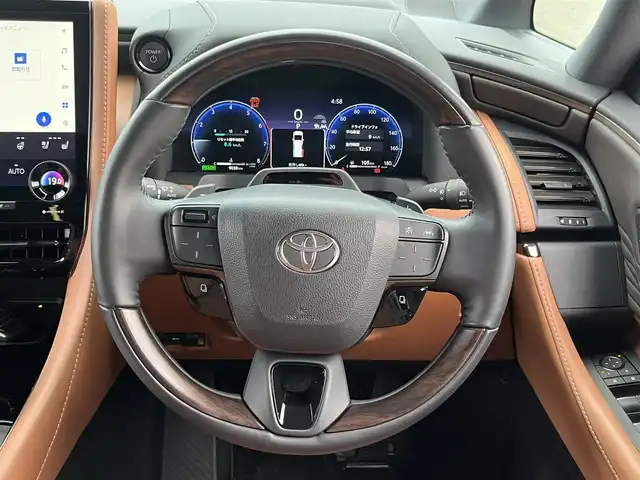トヨタ ヴェルファイア ハイブリット Z プレミア 愛媛県 2023(令5)年 0.9万km プラチナホワイトパールマイカ 登録時走行距離：9038Km/メーカーオプション純正14インチHDナビ/AM/FM/フルセグTV/Bluetooth/ビルトインＥＴＣ2.0/後席モニター/全周囲カメラ/前後ドライブレコーダー/両側パワスラ/電動リアゲート/ワイヤレス充電/パドルシフト/追従クルコン/革シート/デジタルミラー/横滑り防止装置/パーキングアシスト/LEDヘッドライト/オートライト/オートハイビーム/フォグランプ/エンジンスタートボタン/スマートキー/純正アルミホイール/純正フロアマット/シートーヒーター/エアシート/シートメモリ