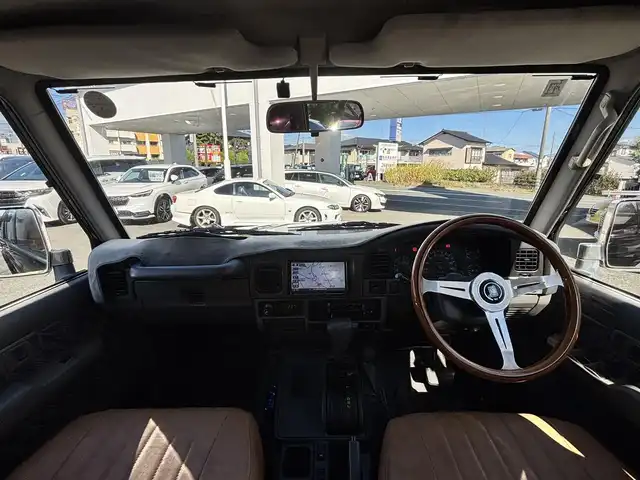 トヨタ ランドクルーザー プラド SX ワイド 熊本県 1995(平7)年 14.4万km 黒 2インチアップ車/NARDIステアリング/社外ナビ/【フルセグTV/CD/DVD/BT/SD】/バックカメラ/革調シートカバー/純正15インチAW/ETC/純正フロアマット