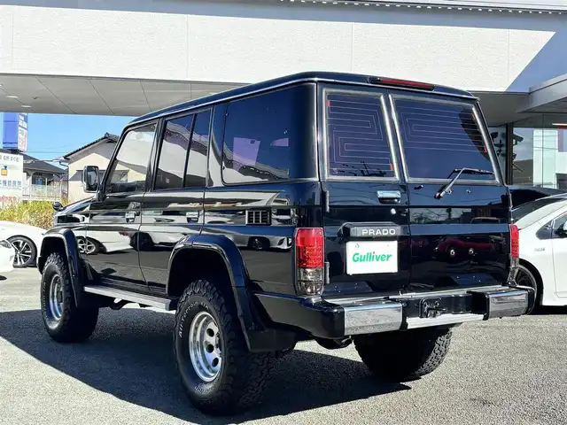 トヨタ ランドクルーザー プラド SX ワイド 熊本県 1995(平7)年 14.4万km 黒 2インチアップ車/NARDIステアリング/社外ナビ/【フルセグTV/CD/DVD/BT/SD】/バックカメラ/革調シートカバー/純正15インチAW/ETC/純正フロアマット