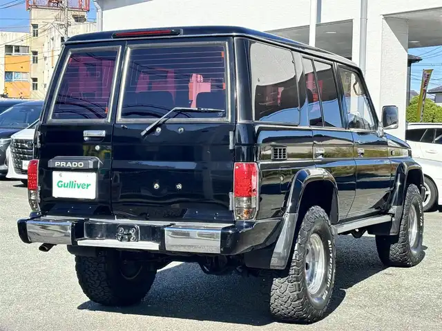 トヨタ ランドクルーザー プラド SX ワイド 熊本県 1995(平7)年 14.4万km 黒 2インチアップ車/NARDIステアリング/社外ナビ/【フルセグTV/CD/DVD/BT/SD】/バックカメラ/革調シートカバー/純正15インチAW/ETC/純正フロアマット