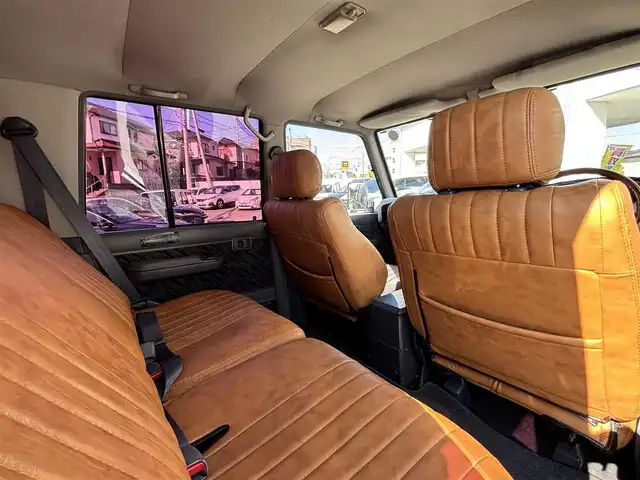 トヨタ ランドクルーザー プラド SX ワイド 熊本県 1995(平7)年 14.4万km 黒 2インチアップ車/NARDIステアリング/社外ナビ/【フルセグTV/CD/DVD/BT/SD】/バックカメラ/革調シートカバー/純正15インチAW/ETC/純正フロアマット