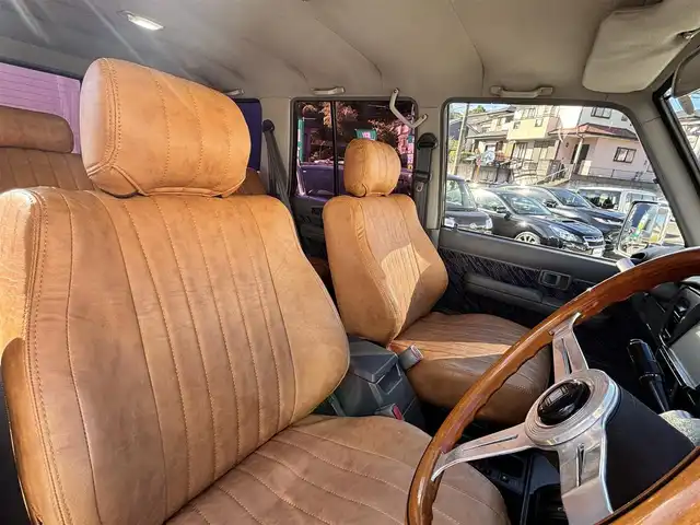 トヨタ ランドクルーザー プラド SX ワイド 熊本県 1995(平7)年 14.4万km 黒 2インチアップ車/NARDIステアリング/社外ナビ/【フルセグTV/CD/DVD/BT/SD】/バックカメラ/革調シートカバー/純正15インチAW/ETC/純正フロアマット