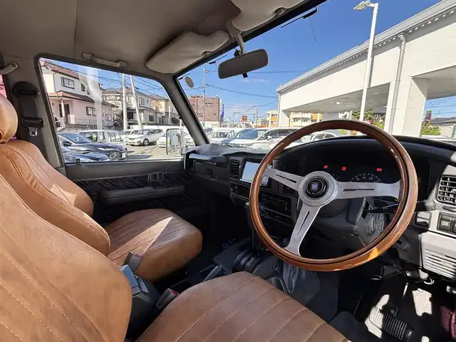 トヨタ ランドクルーザー プラド SX ワイド 熊本県 1995(平7)年 14.4万km 黒 2インチアップ車/NARDIステアリング/社外ナビ/【フルセグTV/CD/DVD/BT/SD】/バックカメラ/革調シートカバー/純正15インチAW/ETC/純正フロアマット