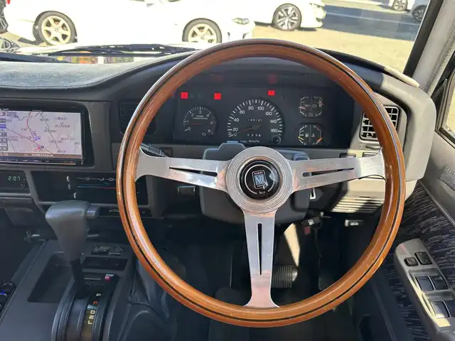 トヨタ ランドクルーザー プラド SX ワイド 熊本県 1995(平7)年 14.4万km 黒 2インチアップ車/NARDIステアリング/社外ナビ/【フルセグTV/CD/DVD/BT/SD】/バックカメラ/革調シートカバー/純正15インチAW/ETC/純正フロアマット