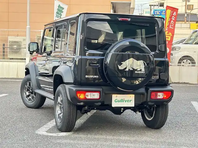 スズキ ジムニー ノマド FC 大分県 2025(令7)年 0.1千km 黒 ・ワンオーナー/・プッシュエンジンスタート/・誤発進抑制機能/・後退時ブレーキサポート/・後方誤発進抑制機能/・車線逸脱警報機能/・ふらつき警報機能/・プリクラッシュセーフティシステム/・横滑り制御システム/・ハイビームアシスト/・先行車発進お知らせ機能/・アダプティブクルーズコントロール/・標識認識機能/・ヘッドランプウォッシャー/・ヒーテッドドアミラー/・ステアリングスイッチ/・シートヒーター　運転席/助手席/・ダウンヒルアシスト/・レベライザー/・ウィンカーミラー/・革巻ステアリング/・背面タイヤ/・純正15インチアルミホイル/・ガンメタリック塗装フロントグリル/・LEDランプ/・フォグランプ/・純正フロアマット/・保証書/・取扱説明書/・スペアキー１本/・カラーコード　WB３