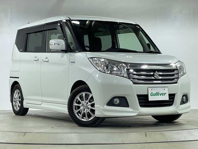 スズキ ソリオ HV MZ 神奈川県 2016(平28)年 3.7万km ピュアホワイトP 社外SDナビ・7型/型式　CN-R330D/両側パワースライドドア/デュアルカメラブレーキサポート/クルコン/D席シートヒーター/ビルトインETC/社外ドラレコ（前後）/純正フロアマット/ステアリングスイッチ/プッシュスタート/スマートキー/スペアキー/取扱説明書/保証書/HIDヘッドライト/オートライト/純正14インチAW/ルーフレール/ドアバイザー/電動格納ミラー/誤発進抑制機能/車線逸脱警報機能/ふらつき警報機能/先行車発進お知らせ機能/エマージェンシーストップシグナル