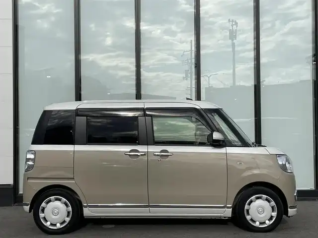 ダイハツ ムーヴ キャンバス 大阪府 2021(令3)年 2.2万km パールホワイトⅢ/ナチュラルベージュマイカメタリック 2トーン 社外ナビ　Stradaナビ/・Bluetooth/フルセグTV/CD/DVD/IPod/ラジオ/主要装備/・アラウンドビューモニター/・衝突軽減ブレーキ/・横滑り防止装置/・両側パワースライドドア/・ステアリングスイッチ/・ハロゲンヘッドライト/・オートマチックハイビーム/・ヘッドライトレベライザー/・フォグランプ/・純正ホイールキャップ/・純正フロアマット/・前後ドライブレコーダー/・ETC