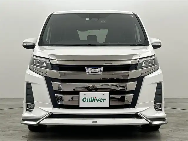トヨタ ノア ハイブリッド Si ダブルバイビー 福岡県 2018(平30)年 7.6万km ホワイトパールクリスタルシャイン モデリスタエアロ　/純正１０型ナビ　/純正１２．１型フリップダウンモニター　/ＥＴＣ２．０　/前方ドラレコ　/バックカメラ　/トヨタセーフティセンス　/両側パワースライドドア　/シートヒーター　/ハーフレザー　/ＬＥＤ