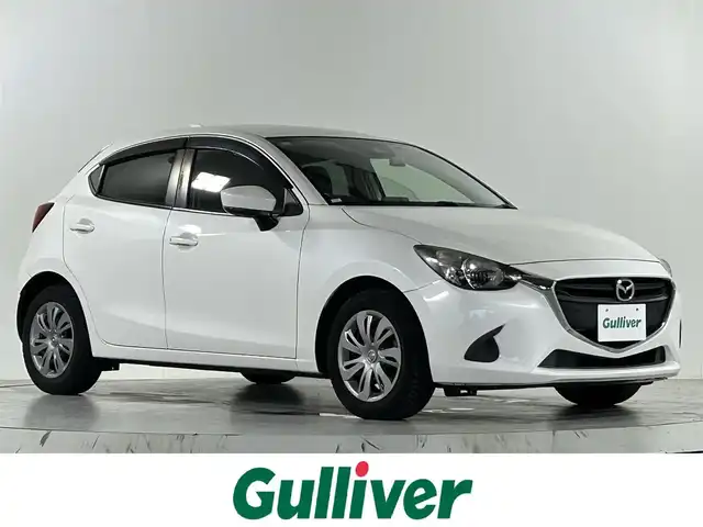 マツダ デミオ 15S 佐賀県 2018(平30)年 1.5万km スノーフレイクホワイトパールマイカ 純正7インチナビ/フルセグTV/DVD/CD/Bluetooth/衝突被害軽減システム/ブラインドスポットモニター/パーキングソナー/車線逸脱警報/横滑り防止装置/オートライト/前後ドライブレコーダー/アイドリングストップ/スマートキー/純正フロアマット/ドアバイザー/ISOFIX対応シート