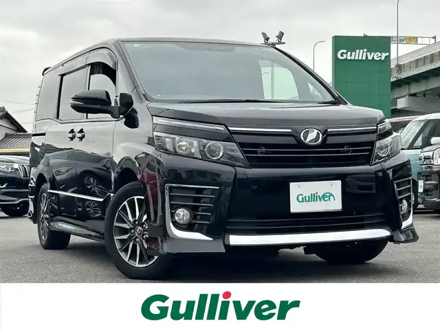トヨタ ヴォクシー ZS 愛知県 2014(平26)年 10.3万km ブラック スマートキー/プッシュスタート/純正9インチナビ/フルセグTV/BT/バックカメラ/純正フリップダウンモニター/ビルトインETC/純正16インチAW/片側パワースライドドア/オートライト/純正フロアマット/純正ドアバイザー/取説、保証書