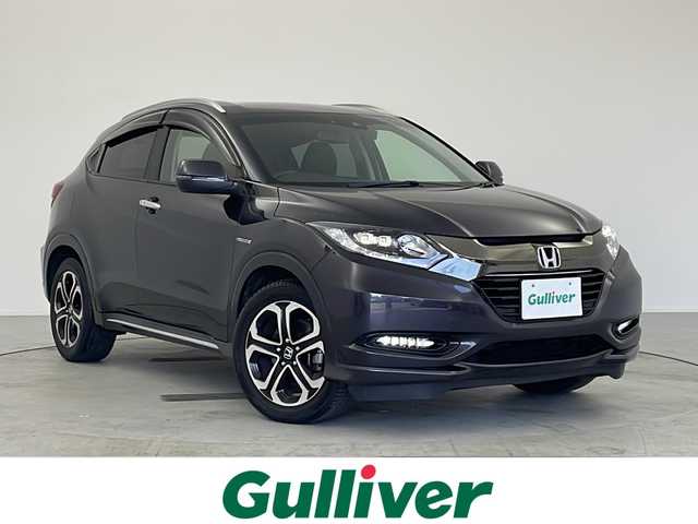 ホンダ ヴェゼル ハイブリッド Z ホンダセンシング 愛知県 2017(平29)年 5.7万km ルーセブラックM /禁煙車//純正ナビ(VXM-164VFi)//フルセグTV・AMFM・CD・DVD・SD・Bluetooth//バックカメラ//ETC//コンフォートビューパッケージ//ホンダセンシング//LEDヘッドライト//オートライト//フロントフォグランプ//ルーフレール//メッキフロントバンパーガーニッシュ//メッキフロントフォグガーニッシュ//チタン風マフラーカッター//専用インテリア(スエード調+ブラウンステッチ)//プライムスムース&スエード調コンビシート//前席シートヒーター//プラズマクラスター//電子パーキングブレーキ//ブレーキホールド//純正18インチアルミホイール//無限フロアマット//無限ドアバイザー//革巻きステアリング//ステアリングスイッチ//プッシュスタート//電動格納ミラー//アイドリングストップ//イモビライザー//新車保証書