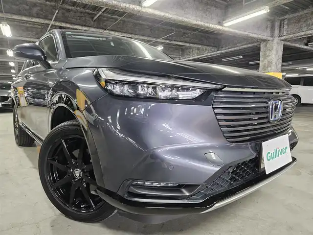 ホンダ ヴェゼル ハイブリッド e:HEV Z 島根県 2021(令3)年 9.7万km メテオロイドグレーメタリック 4WD/純正MOP9型ナビ/フルセグTV/ハンズフリーパワーバックドア/バックカメラ/ビルトインETC2.0/前後ドライブレコーダー/アダプティブクルーズコントロール/前後パーキングセンサー/ホンダセンシング/・衝突被害軽減ブレーキ/・車線逸脱防止支援システム/・前後誤発進抑制機能/・オートハイビーム/ブラインドスポットインフォメーション/フルLEDヘッドランプ/革巻きステアリング/パドルシフト/ハーフレザーシート/前席シートヒーター/社外18インチアルミホイール/スマートキー/プッシュエンジンスタート/禁煙車