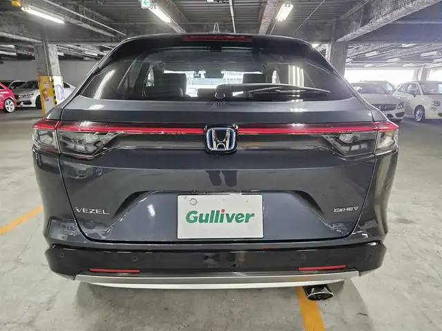 ホンダ ヴェゼル ハイブリッド e:HEV Z 島根県 2021(令3)年 9.7万km メテオロイドグレーメタリック 4WD/純正MOP9型ナビ/フルセグTV/ハンズフリーパワーバックドア/バックカメラ/ビルトインETC2.0/前後ドライブレコーダー/アダプティブクルーズコントロール/前後パーキングセンサー/ホンダセンシング/・衝突被害軽減ブレーキ/・車線逸脱防止支援システム/・前後誤発進抑制機能/・オートハイビーム/ブラインドスポットインフォメーション/フルLEDヘッドランプ/革巻きステアリング/パドルシフト/ハーフレザーシート/前席シートヒーター/社外18インチアルミホイール/スマートキー/プッシュエンジンスタート/禁煙車