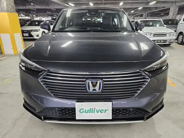 ホンダ ヴェゼル ハイブリッド e:HEV Z 島根県 2021(令3)年 9.7万km メテオロイドグレーメタリック 4WD/純正MOP9型ナビ/フルセグTV/ハンズフリーパワーバックドア/バックカメラ/ビルトインETC2.0/前後ドライブレコーダー/アダプティブクルーズコントロール/前後パーキングセンサー/ホンダセンシング/・衝突被害軽減ブレーキ/・車線逸脱防止支援システム/・前後誤発進抑制機能/・オートハイビーム/ブラインドスポットインフォメーション/フルLEDヘッドランプ/革巻きステアリング/パドルシフト/ハーフレザーシート/前席シートヒーター/社外18インチアルミホイール/スマートキー/プッシュエンジンスタート/禁煙車