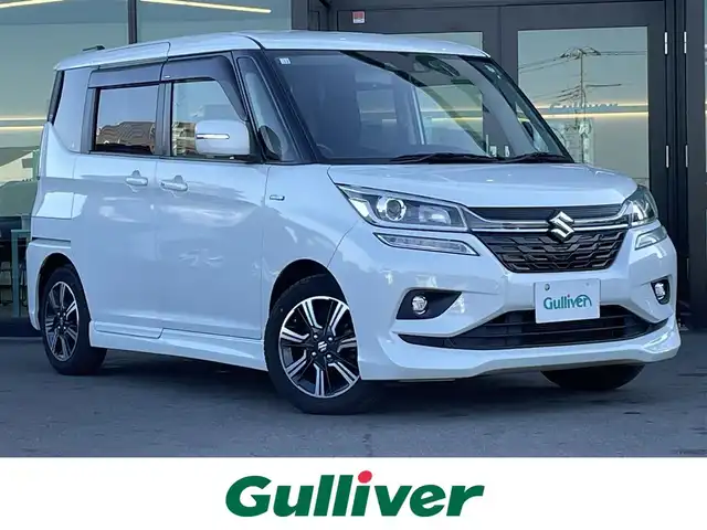 スズキ ソリオ バンディット HV MV 東京都 2020(令2)年 5.6万km パール 純正８型ナビ（CD/DVD/USB/SD/Bluetooth）/スズキセーフティセンス衝突軽減ブレーキ/レーダークルーズコントロール/前後コーナーセンサー/レーンキープアシスト/片側パワースライドドア/パドルシフト/前席シートヒーター/バックカメラ/後席サンシェード/純正バイザー/フロアマット