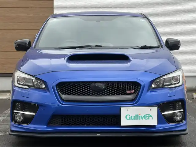 スバル ＷＲＸ ＳＴＩ STI 秋田県 2014(平26)年 4.1万km WRブルーパール 6速MT/４WD/ターボ/STI製ドライカーボンリヤスポイラー/STI製アルミホイール/フルエアロ/ローダウン（TEIN製）/純正サスペンション積込/スマートキー/ETC/プッシュスタート/純正フロアマット/純正ドアバイザー/パワーステアリング/パワーウィンドウ/オートエアコン/オートライト/電動格納ウィンカーミラー/保証書/取扱説明書/記録簿