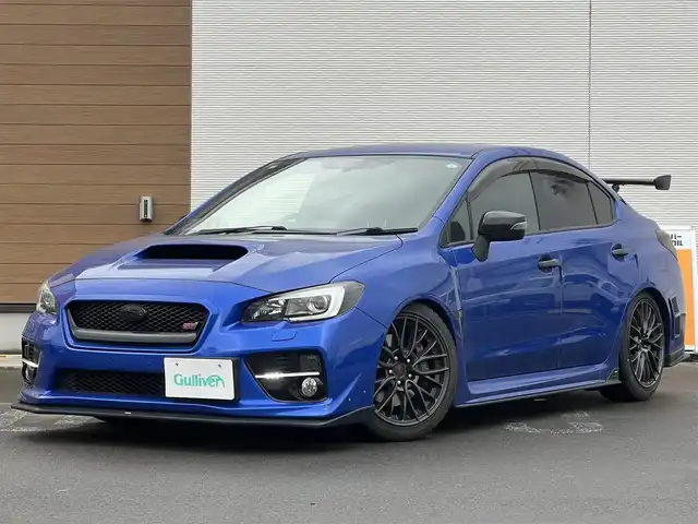 スバル ＷＲＸ ＳＴＩ STI 秋田県 2014(平26)年 4.1万km WRブルーパール 6速MT/４WD/ターボ/STI製ドライカーボンリヤスポイラー/STI製アルミホイール/フルエアロ/ローダウン（TEIN製）/純正サスペンション積込/スマートキー/ETC/プッシュスタート/純正フロアマット/純正ドアバイザー/パワーステアリング/パワーウィンドウ/オートエアコン/オートライト/電動格納ウィンカーミラー/保証書/取扱説明書/記録簿