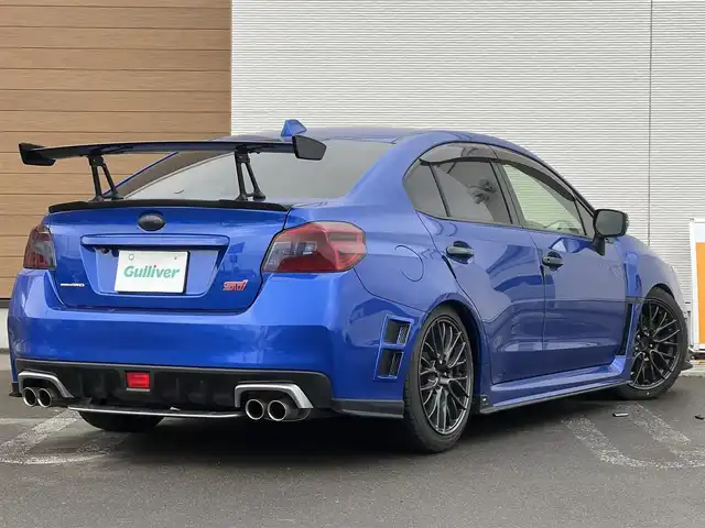 スバル ＷＲＸ ＳＴＩ STI 秋田県 2014(平26)年 4.1万km WRブルーパール 6速MT/４WD/ターボ/STI製ドライカーボンリヤスポイラー/STI製アルミホイール/フルエアロ/ローダウン（TEIN製）/純正サスペンション積込/スマートキー/ETC/プッシュスタート/純正フロアマット/純正ドアバイザー/パワーステアリング/パワーウィンドウ/オートエアコン/オートライト/電動格納ウィンカーミラー/保証書/取扱説明書/記録簿