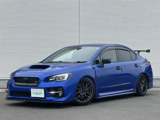 スバル ＷＲＸ ＳＴＩ STI 秋田県 2014(平26)年 4.1万km WRブルーパール 6速MT/４WD/ターボ/STI製ドライカーボンリヤスポイラー/STI製アルミホイール/フルエアロ/ローダウン（TEIN製）/純正サスペンション積込/スマートキー/ETC/プッシュスタート/純正フロアマット/純正ドアバイザー/パワーステアリング/パワーウィンドウ/オートエアコン/オートライト/電動格納ウィンカーミラー/保証書/取扱説明書/記録簿