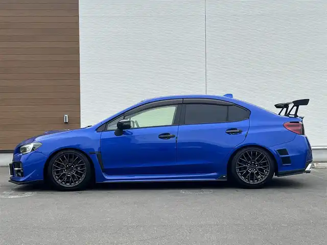 スバル ＷＲＸ ＳＴＩ STI 秋田県 2014(平26)年 4.1万km WRブルーパール 6速MT/４WD/ターボ/STI製ドライカーボンリヤスポイラー/STI製アルミホイール/フルエアロ/ローダウン（TEIN製）/純正サスペンション積込/スマートキー/ETC/プッシュスタート/純正フロアマット/純正ドアバイザー/パワーステアリング/パワーウィンドウ/オートエアコン/オートライト/電動格納ウィンカーミラー/保証書/取扱説明書/記録簿