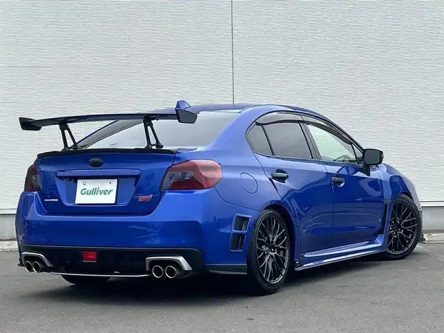 スバル ＷＲＸ ＳＴＩ STI 秋田県 2014(平26)年 4.1万km WRブルーパール 6速MT/４WD/ターボ/STI製ドライカーボンリヤスポイラー/STI製アルミホイール/フルエアロ/ローダウン（TEIN製）/純正サスペンション積込/スマートキー/ETC/プッシュスタート/純正フロアマット/純正ドアバイザー/パワーステアリング/パワーウィンドウ/オートエアコン/オートライト/電動格納ウィンカーミラー/保証書/取扱説明書/記録簿