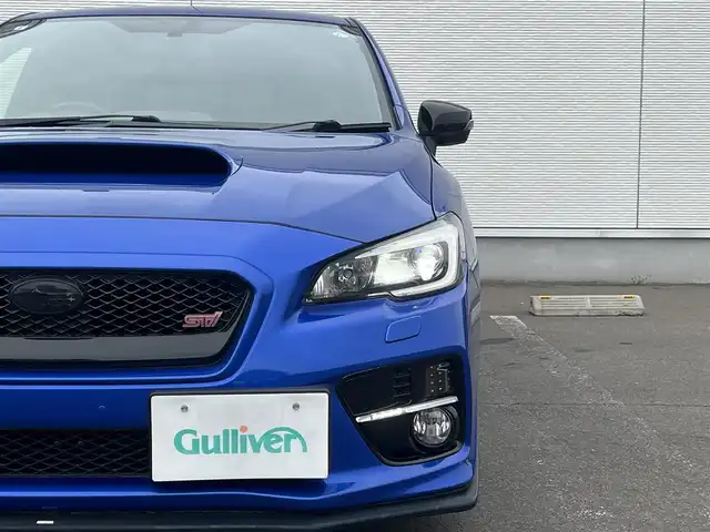 スバル ＷＲＸ ＳＴＩ STI 秋田県 2014(平26)年 4.1万km WRブルーパール 6速MT/４WD/ターボ/STI製ドライカーボンリヤスポイラー/STI製アルミホイール/フルエアロ/ローダウン（TEIN製）/純正サスペンション積込/スマートキー/ETC/プッシュスタート/純正フロアマット/純正ドアバイザー/パワーステアリング/パワーウィンドウ/オートエアコン/オートライト/電動格納ウィンカーミラー/保証書/取扱説明書/記録簿