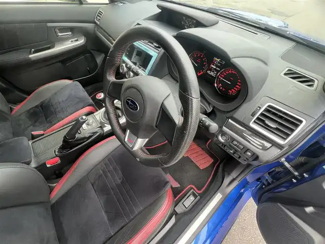 スバル ＷＲＸ ＳＴＩ STI 秋田県 2014(平26)年 4.1万km WRブルーパール 6速MT/４WD/ターボ/STI製ドライカーボンリヤスポイラー/STI製アルミホイール/フルエアロ/ローダウン（TEIN製）/純正サスペンション積込/スマートキー/ETC/プッシュスタート/純正フロアマット/純正ドアバイザー/パワーステアリング/パワーウィンドウ/オートエアコン/オートライト/電動格納ウィンカーミラー/保証書/取扱説明書/記録簿