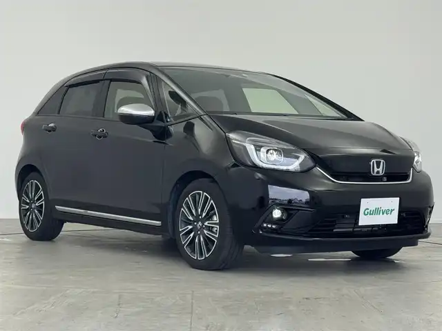 ホンダ フィット e:HEVリュクス 愛知県 2020(令2)年 4.2万km クリスタルブラックパール 純正9型ナビ（フルセグ、CD、DVD、Bluetooth）/ETC/Bカメラ/シートヒーター/ハンドルヒーター/コーナーセンサー/オートハイビーム/LEDヘッドライト/ドラレコ前後/置くだけ充電/ACC/純正16インチAW/衝突軽減ブレーキ/レーンキープアシスト/オートハイビーム/三点エアバック/横滑り防止装置/スマートキー