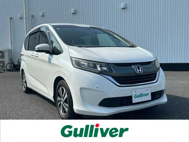 ホンダ フリード G ホンダセンシング 千葉県 2017(平29)年 6.4万km ホワイトオーキッドパール 社外SDナビ/(CD/DVD/BT/フルセグTV)/バックカメラ/衝突被害軽減システム/車線逸脱警報/クルーズコントロール/フリップダウンモニター/両側パワースライドドア/横滑り防止装置/ETC/ドライブレコーダー/アイドリングストップ/LEDヘッドライト/フォグランプ/オートライト/ウィンカーミラー/電動格納ミラー/プッシュスタート/スマートキー/フロアマット/ドアバイザー/取扱説明書/保証書