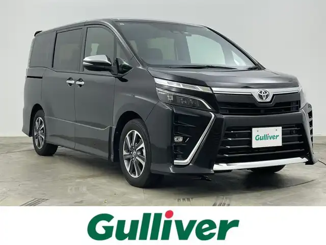 トヨタ ヴォクシー ZS 煌Ⅲ 岡山県 2021(令3)年 4.3万km ブラック アルパイン12.8インチフリップダウンモニター	/アルパインビックX11インチナビ/【ナビ/フルセグ/Bluetooth/DVD/Carplay】	/バックカメラ(サイド付)/クルーズコントロール/オートハイビーム	/LEDヘッドライト（AUTO機能付き）	/ビルトインETC	/衝突軽減ブレーキシステム	/車線逸脱防止システム	/横滑り防止装置/踏み間違い防止装置	/純正ドライブレコーダー（前後）	/純正16インチアルミ	/コーナーセンサー（前後）	/社外フロアマット/ステアリングスイッチ		/プッシュスタート	/ISOFIX/後席サンシェイド/シートリフター/シートバックテーブル/ウィンカーミラー