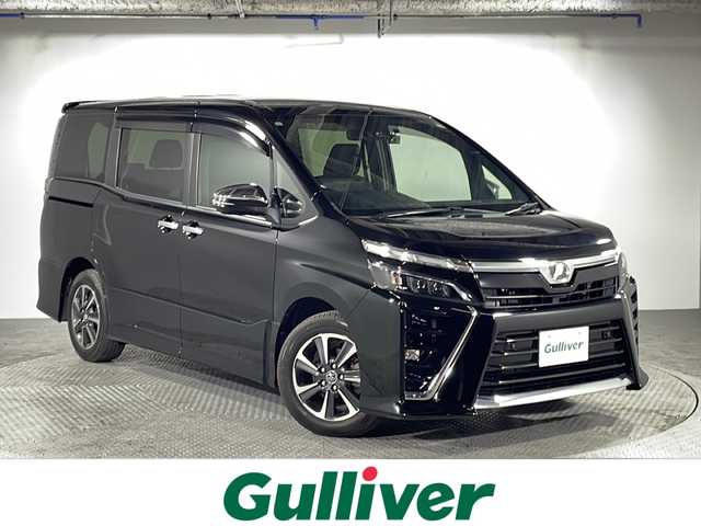 トヨタ ヴォクシー ZS 煌Ⅱ 沖縄県 2019(令1)年 8.1万km ブラック 県外仕入　/禁煙車　/７人乗り　/純正１０インチナビ（ＢＴ，フルセグ，ＣＤ／ＤＶＤ，ラジオ）　/バックカメラ　/両側パワースライドドア　/12.1インチフリップダウンモニター　/クルーズコントロール/ビルドインＥＴＣ　/ドライブレコーダー　/純正１６インチアルミホイール/ＬＥＤヘッドライト