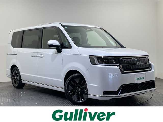 ホンダ ステップワゴン スパーダ eHEV 愛媛県 2025(令7)年 0.1千km プラチナホワイトパール スパーダ　e:HEV　4CJ4AP3　11.4インチナビHonda CONNECTナビ LXM-247VFLi(317900円)　15.6インチ リア席モニター VM-231FE(149600円)/登録済未使用車／純正１５．６インチ後席用モニター／純正１１．４インチホンダコネクトナビ／アダプティブクルーズコントロール／両側電動スライドドア／シートヒーター／ブラインドスポットモニター／オットマン