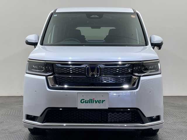 ホンダ ステップワゴン スパーダ eHEV 愛媛県 2025(令7)年 0.1千km プラチナホワイトパール スパーダ　e:HEV　4CJ4AP3　11.4インチナビHonda CONNECTナビ LXM-247VFLi(317900円)　15.6インチ リア席モニター VM-231FE(149600円)/登録済未使用車／純正１５．６インチ後席用モニター／純正１１．４インチホンダコネクトナビ／アダプティブクルーズコントロール／両側電動スライドドア／シートヒーター／ブラインドスポットモニター／オットマン