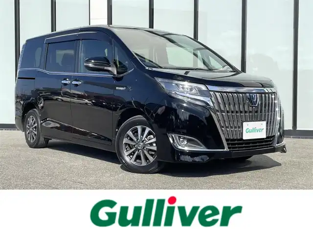 トヨタ エスクァイア ハイブリッド Gi 大阪府 2018(平30)年 4.1万km ブラック 純正9インチナビ/・BT/フルセグTV//純正12インチフリップダウンモニター/バックカメラ/トヨタセーフティセンス/両側パワースライドドア/クルーズコントロール/ビルトインETC2.0/黒レザーシート/シートヒーター/純正フロアマット/純正15インチAW/LEDヘッド・フォグ/取説