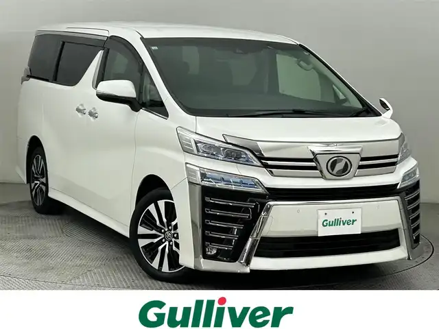トヨタ ヴェルファイア Z Gエディション 道央・札幌 2018(平30)年 4.9万km ホワイトパールクリスタルシャイン ・４WD/・寒冷地仕様/・純正１０インチナビ/・バックカメラ/・ドライブレコーダー/・フルセグＴＶ＆ＣＤ＆ＤＶＤ＆ＢＴ/・パワーシート/・シートヒーター＆ベンチレーション/・デジタルインナーミラー/・ＢＳＭ/・前後障害物センサー/・両側パワースライドドア/・パワーバックドア/・衝突軽減ブレーキ/・レーンアシスト/・横滑り防止機能/・アダプティブクルーズコントロール/・アイドリングストップ/・電動格納ウインカーミラー/・純正アルミホイール/・純正フロアマット/・オートライト/・オートハイビーム/・前後障害物センサー