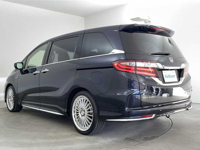 ホンダ オデッセイ ハイブリッド アブソルート・EXホンダセンジング 兵庫県 2018(平30)年 3.1万km プレミアムヴィーナスブラックP ・純正ナビ/CD/DVD/Bluetooth/TV/・マルチビューカメラシステム/・ビルトインETC2.0/・純正フリップダウンモニター/・Honda　SENSING/衝突軽減ブレーキ/誤発進抑制機能/歩行者事故低減ステアリング/路外逸脱抑制機能/アダプティブ・クルーズ・コントロール/車線維持支援システム/先行車発進お知らせ機能/標識認識機能/・ブラインドスポットモニター/・ハーフレザー/・前席シートヒーター/・ステアリングスイッチ/・社外１９インチアルミホイール/・ＬＥＤヘッドライト/・フォグランプ/・オートライト/・プッシュスタート/・スマートキー/・電子パーキング/・オートホールド/・ミラーヒーター/・フロアマット/・2列目サンシェード