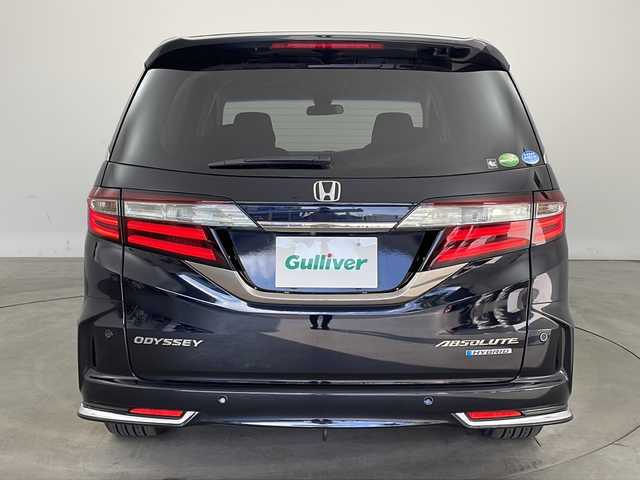 ホンダ オデッセイ ハイブリッド アブソルート・EXホンダセンジング 兵庫県 2018(平30)年 3.1万km プレミアムヴィーナスブラックP ・純正ナビ/CD/DVD/Bluetooth/TV/・マルチビューカメラシステム/・ビルトインETC2.0/・純正フリップダウンモニター/・Honda　SENSING/衝突軽減ブレーキ/誤発進抑制機能/歩行者事故低減ステアリング/路外逸脱抑制機能/アダプティブ・クルーズ・コントロール/車線維持支援システム/先行車発進お知らせ機能/標識認識機能/・ブラインドスポットモニター/・ハーフレザー/・前席シートヒーター/・ステアリングスイッチ/・社外１９インチアルミホイール/・ＬＥＤヘッドライト/・フォグランプ/・オートライト/・プッシュスタート/・スマートキー/・電子パーキング/・オートホールド/・ミラーヒーター/・フロアマット/・2列目サンシェード