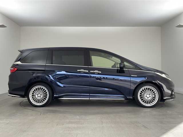 ホンダ オデッセイ ハイブリッド アブソルート・EXホンダセンジング 兵庫県 2018(平30)年 3.1万km プレミアムヴィーナスブラックP ・純正ナビ/CD/DVD/Bluetooth/TV/・マルチビューカメラシステム/・ビルトインETC2.0/・純正フリップダウンモニター/・Honda　SENSING/衝突軽減ブレーキ/誤発進抑制機能/歩行者事故低減ステアリング/路外逸脱抑制機能/アダプティブ・クルーズ・コントロール/車線維持支援システム/先行車発進お知らせ機能/標識認識機能/・ブラインドスポットモニター/・ハーフレザー/・前席シートヒーター/・ステアリングスイッチ/・社外１９インチアルミホイール/・ＬＥＤヘッドライト/・フォグランプ/・オートライト/・プッシュスタート/・スマートキー/・電子パーキング/・オートホールド/・ミラーヒーター/・フロアマット/・2列目サンシェード