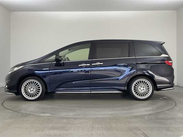 ホンダ オデッセイ ハイブリッド アブソルート・EXホンダセンジング 兵庫県 2018(平30)年 3.1万km プレミアムヴィーナスブラックP ・純正ナビ/CD/DVD/Bluetooth/TV/・マルチビューカメラシステム/・ビルトインETC2.0/・純正フリップダウンモニター/・Honda　SENSING/衝突軽減ブレーキ/誤発進抑制機能/歩行者事故低減ステアリング/路外逸脱抑制機能/アダプティブ・クルーズ・コントロール/車線維持支援システム/先行車発進お知らせ機能/標識認識機能/・ブラインドスポットモニター/・ハーフレザー/・前席シートヒーター/・ステアリングスイッチ/・社外１９インチアルミホイール/・ＬＥＤヘッドライト/・フォグランプ/・オートライト/・プッシュスタート/・スマートキー/・電子パーキング/・オートホールド/・ミラーヒーター/・フロアマット/・2列目サンシェード